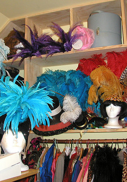 The shelves of Paula the Swedish Housewife's Closet, packed with headpieces and hats and lots of pieces made up of feathers.